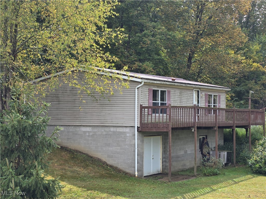 Great investment opportunity. Nearly two acres in a country setting outside Leesville near Leesville Lake and 10 minutes to Tappan Lake. Opportunity abounds in this 3 bedroom manufactured home on a full basement with a wrap around deck and large 34x32 pole building. This fixer upper would make a great affordable home on investment property. Bring your ideas and turn this property into your dream home.