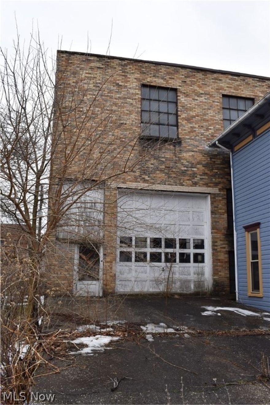 Looking for a large building with high ceilings? Apartment build out possibilities above? Shop space below? The options are endless. This property is being sold as is with contents included (except for the antique truck- seller will remove before closing). Building needs work but what it could be built out into has endless possibilities! Make an offer!