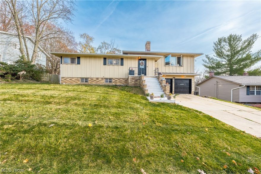 Great opportunity to own this freshly and uniquely updated split level home, located in the heart of Bedford’s Society Hill Subdivision. Enter through the front door and be greeted in the foyer adorned with a beautiful crystal chandelier flowing to the upper level which consists of the bright and airy living room and kitchen area that includes an eat in kitchen on one side and custom built pantry on the other.
The kitchen has updated gorgeous quartz countertops and soft-close cabinets and is equipped with stainless steel appliances, ample cabinet and counter space with access to the 3 tier deck offering scenic neighborhood views. The elegant owner's suite is one of three bedrooms on the main floor and includes a spacious ensuite with walk-in shower, featuring unique tile work throughout, making this bathroom one of a kind! The second full bathroom on the main floor has also been completely updated and offers a massive walk-in shower with beautiful finishes. Downstairs you will find a