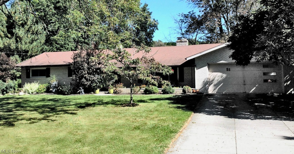 Wow! Tons of updates and remodeling has taken place in this amazing 3 bedroom, 3 full bath ranch overlooking a 1+ acre, manicured lot with mature trees and large pond. You'll love the open floor plan with the modern finishes & sun filled rooms. The formal living room offers a brick front, woodburning fireplace with custom mantle and leads right into the formal dining room and stunning kitchen- which comes with all the newer appliances. Off this area is the oversized, 28x17' family room with a wall of windows with great views and access to the 21x14' Sun Room. All the rooms except the bedrooms have gorgeous Brazillian wood flooring. Updates & improvements include: Remodeled kitchen (08) with concrete countertops, stone backsplash, pendant lighting & appliances. All bathrooms have been completed redone, carpeting in bedrooms, Master has sliders out to back yard, exterior doors (14), attic insulated (10), furnace (07), well pump & associated plumbing (10), 200 Amp elec panel (09),