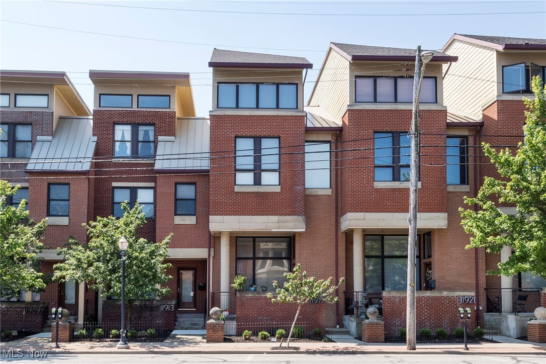 Ever dreamed of having your own private elevator? Read on! Welcome to 11917 Detroit Avenue, this stunning 2006 built townhouse offers the perfect blend of modern comfort and urban convenience. Step inside to discover a home that has been meticulously maintained, reflecting true pride of ownership throughout. All bathrooms have been thoughtfully and tastefully renovated, each one more stylish and charming than the next, with just the right mix of modern touches and character. A brand new hot water tank was installed in 2024. The entire interior has been freshly painted, with the exception of the kitchen, adding a crisp, clean feel throughout the home. Outside, the front porch has been redone, and some new flashing and gutters have been installed to ensure durability. One of the standout features is the private rooftop patio. Perfect for unwinding or entertaining. With a wet bar just inside, creating an ideal flow between indoor and outdoor living. An in-unit elevator provides convenient access across all four floors, and the attached two-car garage adds to the ease of everyday life. Nestled in one of Lakewood’s most walkable and desirable areas, you're just moments away from all the best dining, shopping, and nightlife the city has to offer. Edgewater Park and the beach are just down the road, making sunset strolls and lakeside weekends part of your regular routine. Whether you're seeking a move-in-ready home or a low maintenance lifestyle in a prime location, this townhouse checks all the boxes.