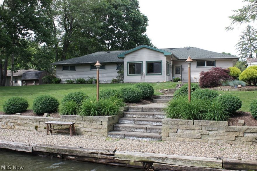 Lakefront on Portage Lakes (main chain of lakes)* Outstanding value for this tastefully updated and decorated 3 bedroom/2 bath ranch with 1708SF, 100' of waterfront on level .49 acre lot, quiet street & includes a covered boat lift* Refinished hardwood floors in dining room, hall & bedrooms* Updated family room (2014) with ventless gas log fireplace, recessed lights, bamboo flooring, skylight & opens to updated 4 season sun room (2014) wrapped with windows, built in benches with storage, bamboo flooring & access to patio...all with backyard and lake view* Updated bath (2017) with walk in shower, vessel sink & heated floor* Oak kitchen with island/breakfast bar, corian counter top, recessed lights, stainless dishwasher (2016) & stainless refrigerator (2017), Jenn air gas range, roll out shelves & pantry* Attached 2.5 car garage* Paver patio with stairs to lake* Outdoor lighting* Lake pump & irrigation system* Storage bldg.* Other updates, including but not limited too, upgraded 220 elec