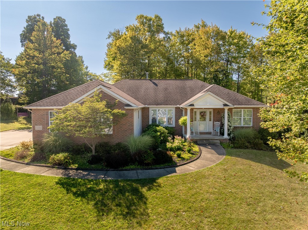 Welcome to this stunning one-owner ranch, custom-built by Rea Homes and tucked away on a quiet cul-de-sac in a desirable neighborhood. Sitting on over an acre lot, this meticulously maintained property offers the perfect blend of comfort, space, and style. Step inside to a welcoming foyer with hardwood floors, opening into the spacious great room with a cozy gas fireplace. The open floor plan flows seamlessly into the eat-in kitchen with bar seating and into the beautiful sunroom featuring cathedral ceilings and walls of windows—the perfect spot to enjoy morning coffee or unwind in the evening. From here, sliding doors lead to a concrete patio with a pergola, ideal for outdoor entertaining. The split bedroom design ensures privacy, with a spacious primary suite boasting hardwood floors, a walk-in closet, and an ensuite with double sinks. Two additional bedrooms and a full bath complete the main living area. For convenience, the home also offers a first-floor laundry and a 3-car garage. The full unfinished basement with an additional full bathroom provides endless possibilities—whether you’re looking for extra living space, a home gym, or a workshop. This home is truly move-in ready, offering timeless design and exceptional care throughout. Don’t miss the chance to make it yours!