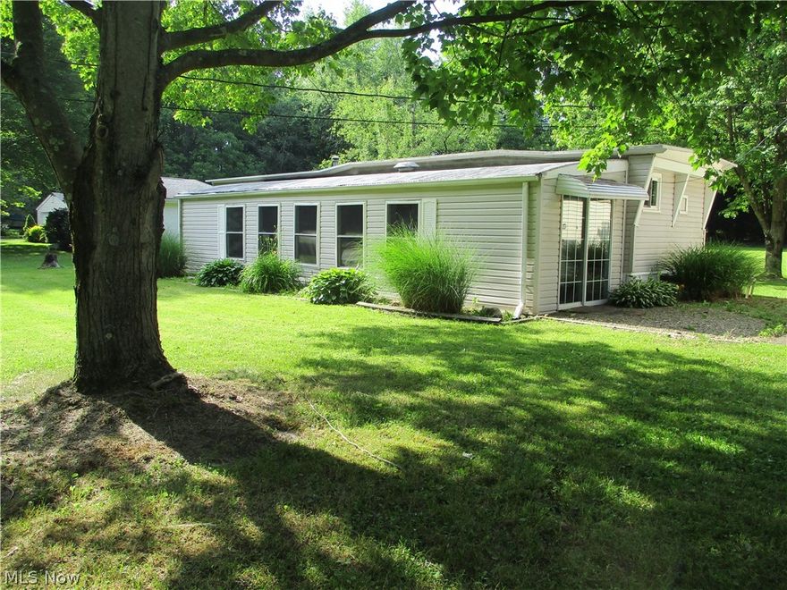 60 amp. service-Garage/Mobile. Covered & enclosed patio, 9 x 39 with concrete floor.  Some furnishings remain.  Possession- transfer + 10 days.