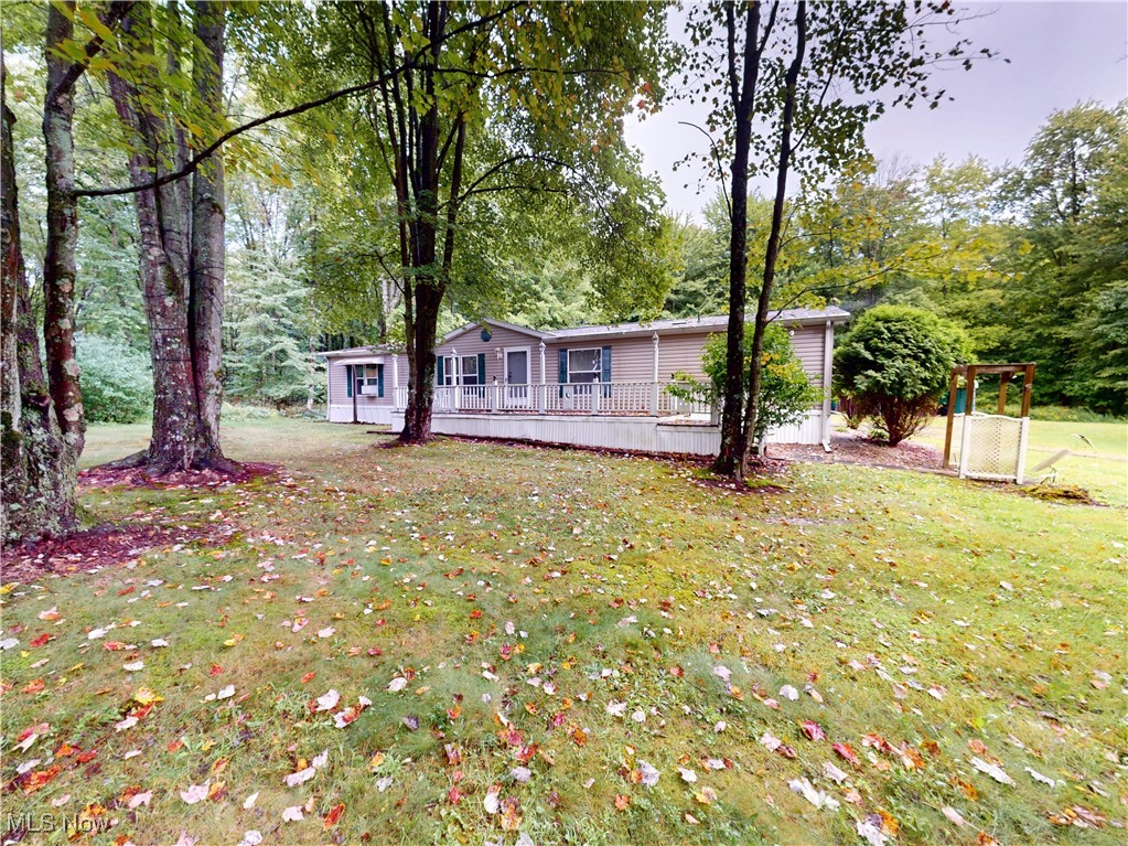 Excellent manufactured home now available in Andover, offering a fantastic opportunity for peaceful country living.
This spacious ranch-style home features three bedrooms and two full bathrooms, providing comfortable living space. The interior boasts an open-concept kitchen that flows into a large family room complete with a cozy fireplace, perfect for gatherings.
Exterior features include a detached two-car garage, a convenient carport, and an enclosed back porch, ideal for enjoying the serene surroundings. The property also comes with a shed for additional storage, and all existing appliances are included with the home. Perhaps one of the most appealing aspects of this property is its setting on over 17 acres of beautiful, wooded land. This expansive lot offers unparalleled privacy and a quiet, tranquil environment.