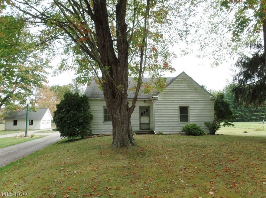 Cute and cozy 3-4 bedroom 1 bath bungalow awaiting your personal touches. Two detached two car garages, a Updates include septic, roof, HVAC, and electric panel. Beautiful mature wooded trees on the back half of the property.