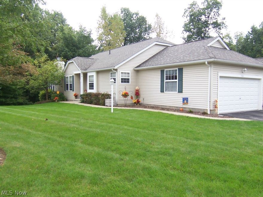 Welcome home! This gorgeous condo is situated on a lovely wooded lot in popular Woodbury! It boasts 2 bedrooms, 2 bathrooms, a heated sun room, a fully applianced kitchen, a vaulted great room w/a formal dining area, and a first-floor laundry. The lower level (plumbed for a bath, w/loads of built-in storage) walks out to a private back yard with a small stream meandering through the woods! There is also a double patio - perfect for a swing and afternoon barbecues! There are updates thru-out that include Silk strand carpet w/20 yr warranty (2013), solid surface counter tops w/continuous back splash in kitchen, master bath, and guest bath (2009), Moen faucets w/lifetime warranty, newer light fixture in dining room, built-in cabinets in great room flanking the fireplace, surround sound in great room (incl Blue Ray player & CD changer/master bedroom, newer laminate flooring in the sun room, loads of storage cabinets in the first floor laundry, ADT security, H20 (2012), newer M/W oven (2012