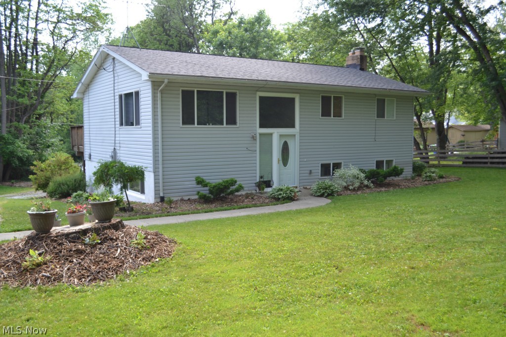 TRENDY, COOL, TUCKED AWAY in Portage Lakes.. welcome to this 3 bedroom 2 ba home. Home completely remodeled / updated. Decor very tasteful. Just move in. Looking for that house on a larger lot that has space for your toys ... or just want a little land? This one is for you. Hardwood throughout 1st floor. All appliances stay. Fire pit, entrance to the property from 2 different streets! Large deck off of the kitchen. Lower level offers a family room w/ a fireplace and bath, laundry room and gym area. The basement walks out to a beautiful private extra large back yard. Call this one home. Oil / gas royalties transfer with the property. Call me today for a private showing