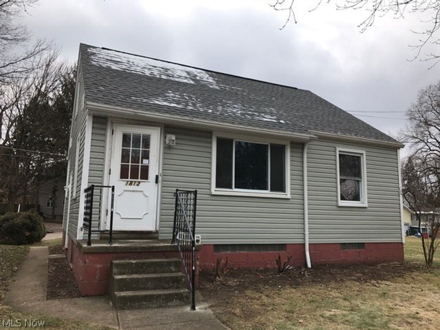 LOOKING GREAT ON THE OUTSIDE with newer roof, vinyl siding and replacement windows.  Attached garage.   Full basement.
