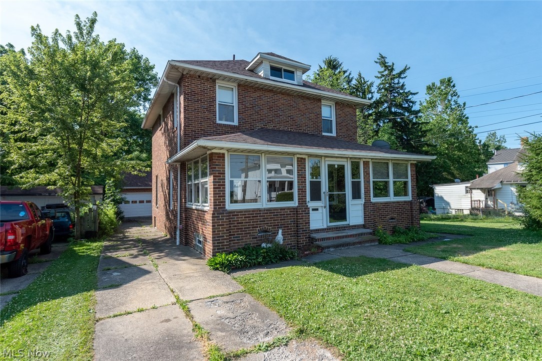 Beautiful all-brick colonial with tremendous potential! This striking four bedroom home is just waiting for your creative vision to bring it back to life! A lovely three-season porch opens to the spacious living room, where you will find hardwood floors under the carpet. The dining room flows into the eat-in kitchen. Upstairs, there are four large bedrooms and a full bathroom. The lower level includes a spacious rec room, a laundry area, another full bathroom, and plenty of space for storage. Outside, there is a back patio area and a two-car garage with a bonus lower level. The backyard is very large and backs up to a creek, providing peace and privacy! Located off of Broadway Ave in Bedford, this home is minutes from Bedford Reservation and area highways.