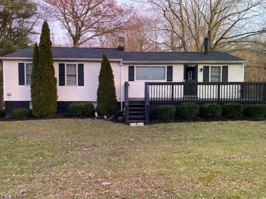 Wow!!! Beautifully remodeled ranch in the Green school district! Over an acre of land with a meandering stream and mature woods!! Many, many updates within the last few years including a new kitchen with pretty white cabinets (lifetime warranty), rich granite counter tops and stainless appliances. Gorgeous new flooring, carpeting, lighting and paint throughout! The new bathroom has double sinks in the marble vanity top, a soaker tub and new toilet. A new 1/2 bath was added to the master suite. More major updates include a new roof, new furnace & central air conditioning. Open floor plan with a large picture window & charming wood burner, huge master and bedroom 2 with a tandem bonus room - perfect for a walk-in closet, office, nursery or play area. The walkout lower level has has a finished rec room and big storage room. Walkout to the back patio or to the 2-car rear load garage. Schedule your showing today. This one won't last!