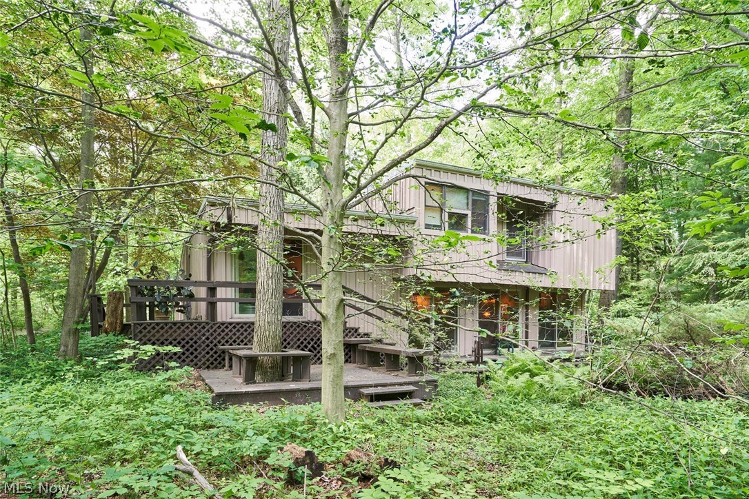 Let nature wrap its arms around you in this unique 3 bedroom 1.5bath home. Hidden on 2 acres in Revere Schools, this home features stunning views with a large wrap around deck, perfect for bird watching and to experience the nature around it. The cozy feel, the home's character and the hard wood floors will surely make you fall in love with it. Oversized fireplace and beautifully done kitchen with granite counter tops make it perfect for entertaining. Great location just minutes from Parks and skiing! Call to set up a private showing