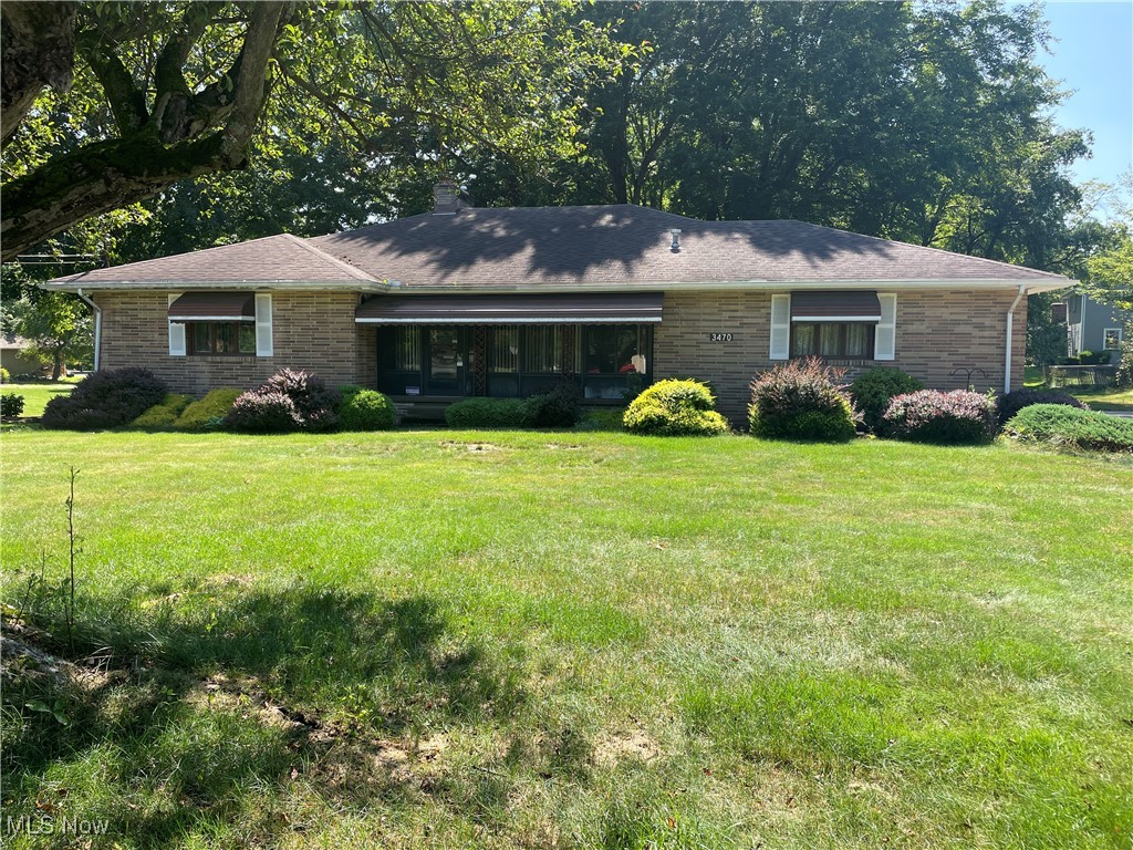 3 bedroom Ranch, 1600 SF Built in 1959 on exceptional private lot in Austintown, Austintown Schools. Master Bedroom with half Bath, 2 additional nice size bedrooms. Full Bath with walk in shower. Eat in kitchen next to formal dining room. Large living room with sandstone brick fireplace. Enclosed front porch with vented gas heater. Whole house fan. Partially finished basement with bar and second complete kitchen. South west corner of basement features walk out doors. Spacious laundry and storage area. Additional private half bath. Newer HVAC featuring Tempstar furnace. Dry basement with high grade ceilings. Attached 2 car garage with overhead storage and water. Roof appears solid. Appears to have Hardwood floors throughout. Exceptional lot with fenced in pet area. Concreate drive. This home needs new surface materials and paint and is ready for its next family from very long term owners.