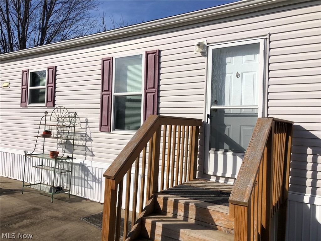 Looking for a newer mobile home to put on your land or vacant lot? Built new in 2016. This is a large Redman, single-wide, mobile home for sale. Land not included. It features 3 bedrooms and 2 full bathrooms, with central air conditioning. The private master bedroom has its own master bath and walk-in closet. The custom kitchen has brown cabinetry, matching Whirlpool refrigerator and stove, and luxury vinyl wood flooring. There are 2 spacious bedrooms at the opposite end, with a full guest bathroom. The third bedroom at the very end of the unit has a sliding glass door that could lead out to a wooden deck or patio. This room could easily be your office or TV room. There is a spacious laundry room off the kitchen, with washer and dryer included. This is a lightly used home, the carpet in the living room and bedrooms, and the vinyl plank flooring in the kitchen and bathrooms, are in excellent condition. This home has central air and propane forced air heat. This could be your perfect