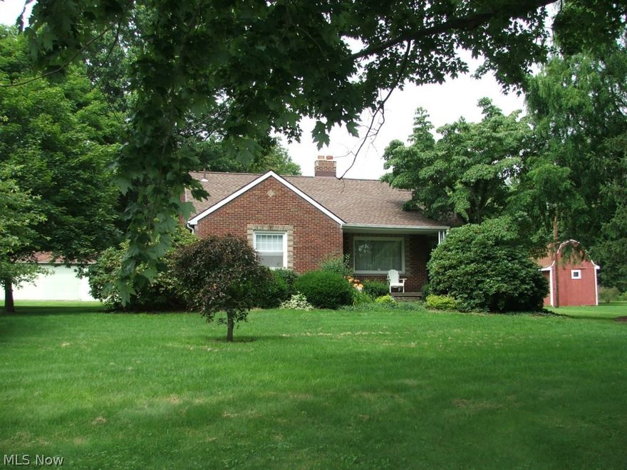 A rare find is the only way to describe this well maintained 3 bedroom brick ranch, hardwood floors, newer vinyl windows, roof, furnace and A/C. Cozy up in the living room with a fire in the stone faced wood burning fireplace.. Waterproofed basement with transferrable life time warranty., with shower stall, glass block windows. Enclosed rear sun room over looks back acres. Move-in condition. Did I mention this gem sits on 10 acres and has detached 2 car garage and oversized metal storage shed? Some of the acreage was a nursery. Call now!