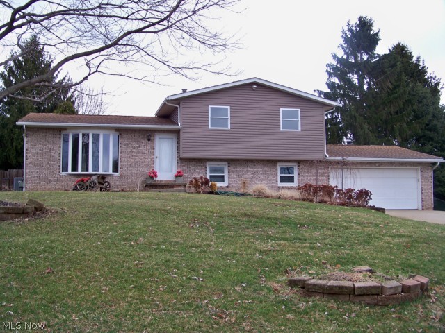 Dream your dreams with open eyes and make them come true in this fabulous home while entertaining your family or guest. Enjoy your morning coffee or evening cocktail in the knotty pine Sunroom overlooking the serenity of your yard. Relax in your in ground heated pool surrounded by a privacy fence, trees, landscaping & patios. Two outbuildings one for your pool equipment & one for your changing house or game tables. The pool has two covers one for winter or summer. The inside is just as impressive with four bedrooms, two full baths and open living room & dining room. Kitchen with eat-in area. Easy access from the family room to the garage & to your outdoor oasis. Plenty of closet storage, unfinished basement & finished crawl space. Oversized two car garage with storage & wide driveway. Newer updates:replacement windows, kitchen, roof, bath, updated crawl space. Summer is just around the corner to live your dreams with your eyes open!