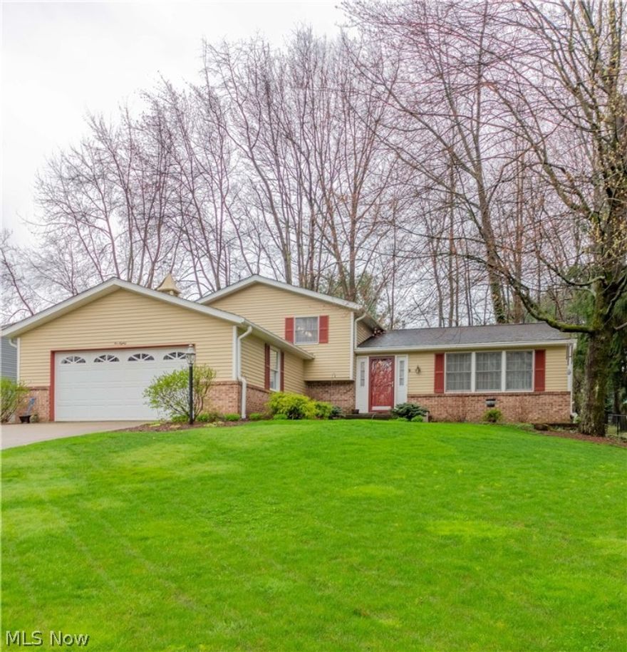 Welcome home to this beautiful 4 level split maintained in exceptional condition. Impressive curb appeal with manicured lawn and mature landscaping. Foyer entry leads to a very spacious,airy,bright & open formal living room and formal dining with new french doors that open wide to the patio and fully fenced park-like backyard. . Beautiful hickory stained laminate wood floors throughout. Kitchen tastefully updated with composite counters, stainless appliances and new floor. Three bedrooms up with a full jack and  jill bathroom. Attractive lower level family room is cozy and inviting with new carpet and a woodburning fireplace. There's also a full bath on this floor and an office area that could be enclosed to a fourth bedroom if needed. The basement has a spacious laundry room, nice finished room and a storage area. Neat, clean and tidy throughout! Other updates include the HVAC in '12, roof in '05, bathroom in '12, new exterior doors and more.