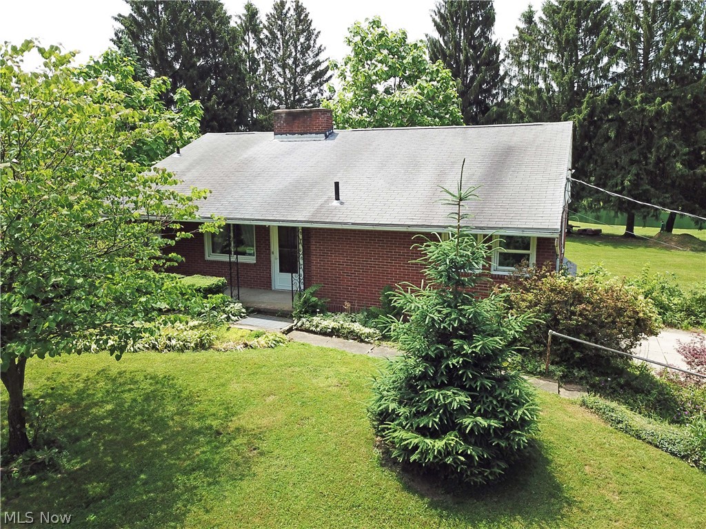 Welcome to 13039 Doylestown Rd in Rittman. This 3 bedroom, 2 bath brick ranch sits on a private, serene property that stretches over 7.2 acres. Spacious living room with fireplace and large window over looking the beautiful backyard. Kitchen has plenty of cabinets, perfect for storage and has access to side yard. Partially finished basement with large bonus room, wet bar, wood burning stove, and full bath. With three ponds, two of which are stocked, multiple fruit trees and berry bushes, this property is every nature lovers dream! Call today to schedule your private tour!
