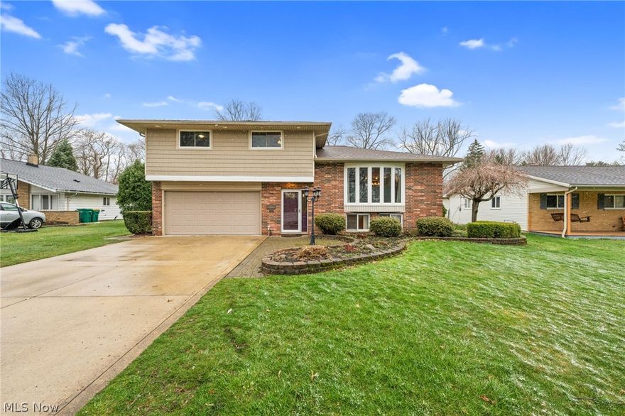 Welcome to this charming split-level home nestled in the heart of Mentor! As you step through the entrance foyer, you'll be greeted by the inviting atmosphere of this well-appointed residence. Ascending the short flight of stairs, you'll find yourself in the spacious living room, perfect for relaxing evenings or entertaining guests. Adjacent to the living room is the dining area, seamlessly connected to the updated kitchen boasting modern appliances, making meal preparation a delight. Conveniently located on the main level is a half bathroom, providing ease and accessibility for guests and residents alike. Venturing upstairs, you'll discover three comfortable bedrooms, offering ample space for rest and relaxation. One of the bedrooms offers a pull out bookcase with access to additional attic storage. A full bathroom completes this level, ensuring convenience for your everyday needs. Descending to the lower level, you'll find a well-appointed laundry room, making chores a breeze, and a cozy family room, ideal for a play space or a quiet retreat. Outside, the fully fenced backyard beckons, offering privacy and security, while the expansive deck provides the perfect setting for outdoor entertainment. Take a refreshing dip in the pool on warm summer days or simply unwind in the tranquil surroundings. Updates include new roof in 2020, 12 x 16 outdoor shed with power, new driveway, garage floor and siding + insulation. With its desirable features and prime location in Mentor, this split-level home offers the perfect blend of comfort, convenience, and relaxation. Don't miss the opportunity to make it yours!