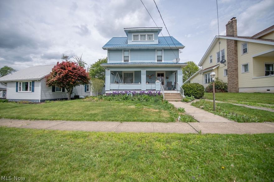 Welcome to this charming two story home, complete with a metal roof and a welcoming covered front porch with classic curb appeal.
Step inside to beautifully preserved original oak woodwork, custom built-ins, and warm character that carries through the living room into the dining room.  The kitchen offers a practical layout with plenty of opportunity to update to your style.  Upstairs, you will find spacious bedrooms, each with generous closet space.  Full bath featuring a bathtub and a separate shower for added convenience.  A walk up third floor provides a large attic space currently used for storage with potential for a finished living space, studio or a quiet retreat.  Outside enjoy a landscaped yard with seasonal blooms, detached garage and a location close to parks, schools and all local amenities.  This is a classic home that blends authentic craftsmanship with comfortable practical living.