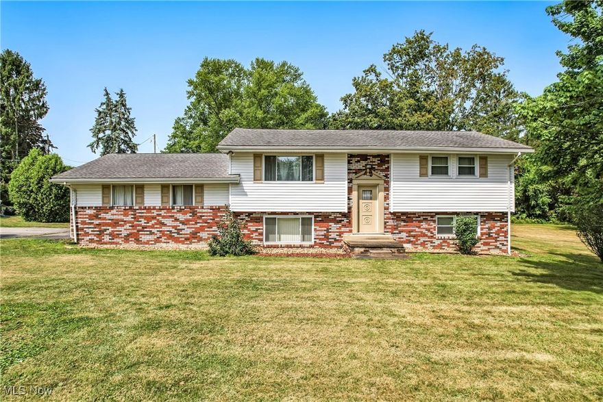 Versatile Home with Unique Layout on 1.61 Acres – Ideal for Multi-Generational Living!  This one-of-a-kind property offers a flexible layout ideal for single-family living, multi-family use, in-law suite, or rental potential. Featuring two identical levels, each includes 2 bedrooms, full bath, kitchen, dining, and living room - great for privacy or shared living!  Additional highlights include:  heated all season room overlooking beautiful backyard, front foyer with optional separate entrances, laundry & storage area, newer vinyl windows, new LVT flooring, and new carpet in lower level, and an amazing 32 x 32 heated detached garage with 12 ft. doors - perfect for vehicles, tools, toys & hobbies!  All this on a beautiful 1.61 acre corner lot in a peaceful country setting!  A truly versatile home with so much potential – come see it for yourself!