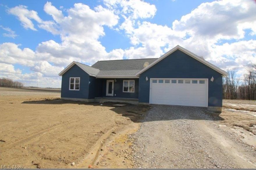 New build.  Open floor plan, large kitchen, dining, and great room concept with cathedral ceilings.  Amish made kitchen cabinetry and trim.  Great room has many plant ledges.  Rear door will open to an (approx.) 10' X 14' deck.  Covered front concrete porch.  County Rd. 23 is scheduled to be repaved in 2016.