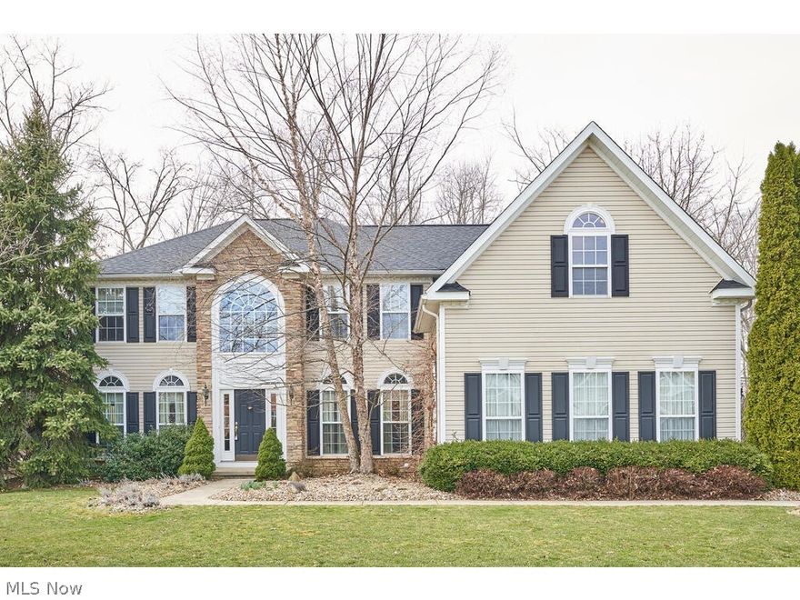 Spacious 4 bed, 5 bath, Hillside colonial with 3 car garage on private wooded lot in Revere School District. 1st floor features great room with stone fireplace, private office, huge kitchen with granite connects to the morning room with access to the 2 tiered deck. Dining room and cozy living room round out 1st floor. 4 bedrooms up including a large master bedroom with tray ceiling and separate reading nook. En-suite bath with 2 walk in closets, stand up shower, soaking tub and 2 vanities. Additional suite upstairs with en-suite bath and 2 additional bedrooms with Jack and Jill bathroom. Walk out lower level nicely finished with huge open space, media room and additional 1/2 bath. Roof and water heater 2020.