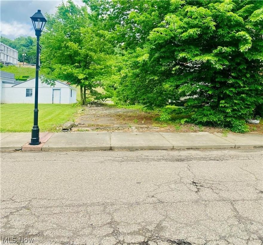 AFFORDABLE LOT FOR SALE IN NEW CUMBERLAND! Build your business on the already existing concrete pad on a FLAT city street only 10 min. from Mountaineer Casino Racetrack. Located within just blocks from the Ohio River. Paved back alley access. Call today!