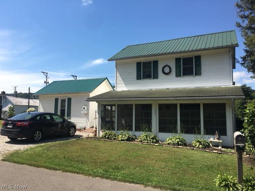 All the work has been done, move in & relax.  Screen in front porch leads into the open living room.  From the original hardwood floors to the new gas fireplace this room is sure to impress.  Large eat in kitchen with new subway title & light fixtures, newer appliances will stay for the new owner.  Instant water heater under the kitchen sink.  Large Bedroom, updated full bath & laundry room complete the first floor.  Owner widen the stairway.  Updated Full bathroom with 2 linen closets & 2 bedrooms complete the 2nd floor.  Newer Central Air, Furnace, Water Heater & Metal Roof.  2 Car Unattached Garage with water & electric and new insulation.   Property also features a salon with half bath and separate cooling/heating from the main home.  Plenty of parking.