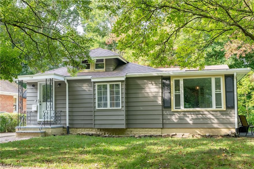 Welcome to this gorgeous Ranch loaded with character and charm. Walking through the front door you will find the oversized living room with new flooring and large windows letting in plenty of natural light. Off of the living room is the updated eat-in kitchen offering new flooring, cabinets, countertops, and brand appliances. Also on the first floor is the family room with a fireplace, completely remodeled bathroom, and a sun room. The basement offers both an unfinished area for storage and a finished area giving you another living space. Outside off of the sun room is the patio. This home has been updated from top to bottom and not only that it has a buildable lot right next to it. Conveniently located next to Goodyear Heights Metro Park and a minute's drive to I-77/I-76/Rt. 8. Come quick! All that's left to do with this home is move in.