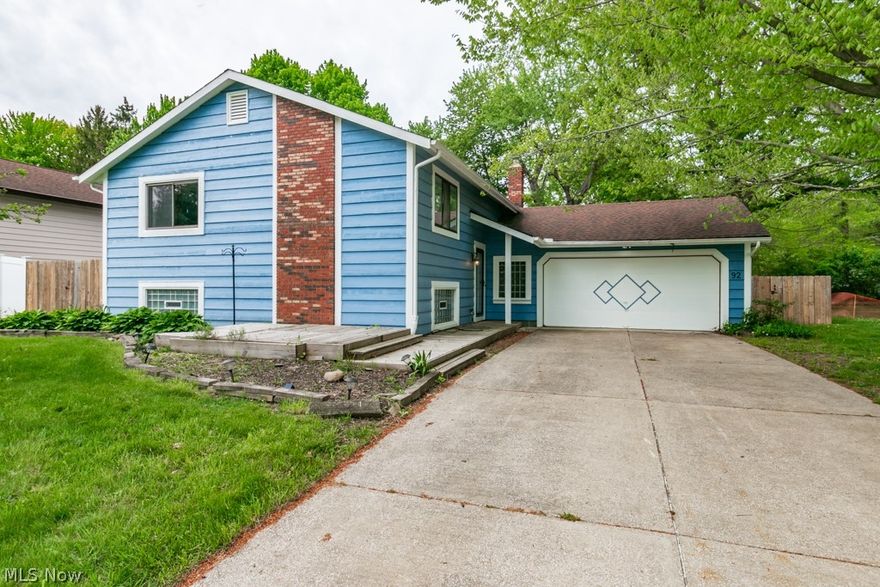 Welcome to this comfortable 4-bedroom, 2-bathroom home in Painesville Township. The kitchen boasts LVT flooring, stainless steel appliances, and a convenient slider leading out to the wooden deck and backyard.  In the dining room, you'll find a practical built-in buffet with cabinetry above, offering ample storage space.  The main floor hosts a full bathroom with double sinks and wood flooring, along with three spacious bedrooms, one of which connects to the full bath.   Downstairs, you'll discover a lower level recreation room, a fourth bedroom, an additional full bathroom, and a utility room equipped with shelving and storage. This home is complete with an attached 2-car garage with pull-down attic access. The outdoors offers plenty of space for family gathering, mature landscaping, and a storage shed. All this home needs is your finishing touch!  Being sold As-Is.