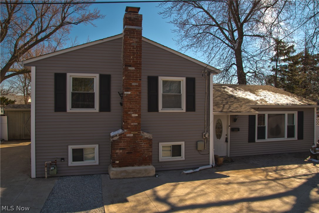 Welcome to this beautiful Split Level Home in Fairport Harbor. As you enter through the front door you will find an Open Floor Plan. The updated kitchen has granite countertops, tile backsplash and a large island with plenty of seating. Off the kitchen you will find French doors that lead to the private fenced in back yard with stamped concert patio . The living room is right off the kitchen with all new wood flooring. The extra large lower level has a brick gas fireplace and a private office, half bath and laundry room. Upstairs offers 3 bedrooms with hardwood floors and an updated full bathroom. Spend many days and nights observing the fantastic views of Lake Erie from your front yard. Great location!!!! Close to the beach, marina, park, restaurants, shopping, schools and much more. Updates include: New High Efficiency Furnace and A/C in 2017, New Hot Water Tank in 2017, Wood floors in 2017, Water Softener 2014, New Sewer Lines 2016. MUST SEE!!!!