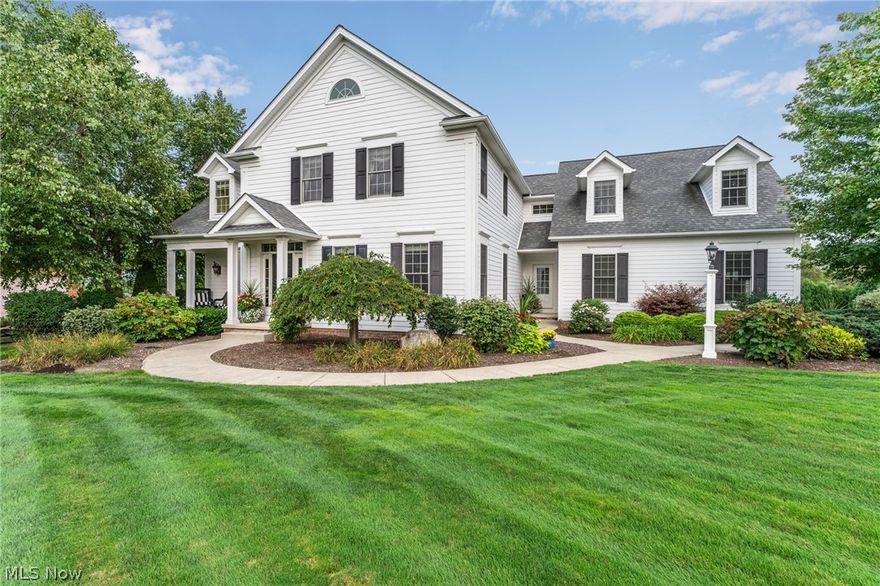 This fabulous home situated on Hole #1 of Kennsington Golf Course will stun you w/its traditional and classic interior. Home built w/Hardie Plank Board, a fiber cement siding. As you walk through the door you will be greeted w/a large foyer, elegant staircase and hardwood flooring throughout. Stroll to the left and enter through a transom doorway to a spacious living room offering coffered ceiling, crown molding and a stunning marble surround fireplace & French doors leading to a quaint veranda, off the living room a spacious, bright family room. A bright dining room surrounded by exquisite crown molding. Enjoy ambiance and warmth in the large kitchen offering an abundance of custom cabinetry, stainless steel Wolf and Jenn Air appliances, granite countertops and a large island. The kitchen also features a cozy sitting area leading onto a secluded southern style covered porch. A sizeable 1/2 bath and pantry complete the first floor. The 2nd floor offers 3 extremely large bedrooms, each