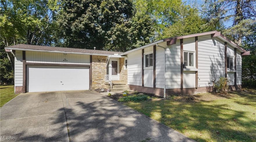 Welcome to 100 Trudy Ave in Munroe Falls!  This spacious ranch features a fabulous open floor plan with a vaulted, beamed great room, dining room, and kitchen! The kitchen has solid surface countertops, freshly painted cabinets and newer stainless steel appliances. The bright, relaxing sun room off of the living room has access to the partially fenced in back yard. The beautiful hardwood floors in the living room, dining room and bedrooms are perfect for todays busy lifestyle. The primary bedroom has a recently updated  attached bath with new shower. There's plenty of space for storage and a rec room in the basement.  A one year home warranty is being offered for your piece of mind.  Schedule your showing today!