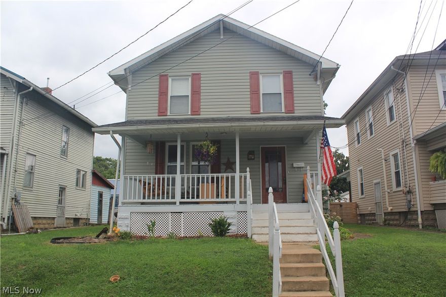 Traditional 2-story, a comfortable home with space and fenced level yard. Newer kitchen open to dining room and living room. Full basement for storage or expansion. Alley access to a detached older building that can be used for a vehicle and/or workshop. Wide welcoming front porch!