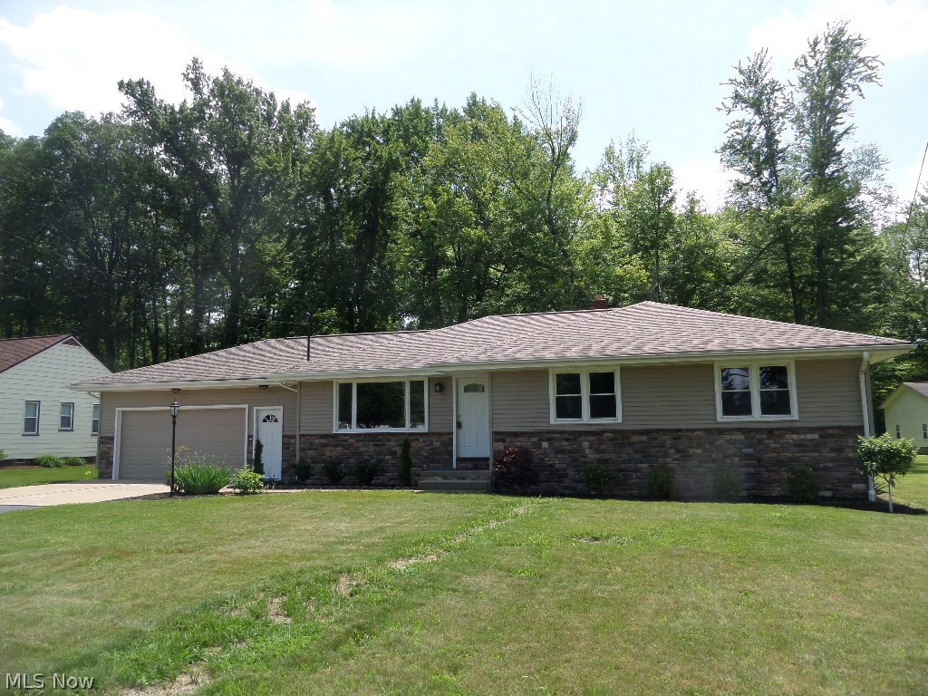 Tastefully updated and completely remodeled Howland ranch on .71 acres with shed. Unbelievable curb appeal in the dark taupe vinyl siding and stone front, new windows, plumbing, furnace. Kitchen with new white shaker cabinets, lovely granite countertops, brand new stainless steel appliances, breakfast bar and large eating area. The kitchen leads to the large, bright "Family room accesses private patio." overlooking the deep backyard. The new bath features dark vanity, dramatic countertops and ceramic floor. The bedrooms feature large windows, new carpeting, and spacious closets. A professional decorator could not have selected more appealing paint colors, carpeting, light fixtures or hard-surfaced floors. This home is sure to impress your friends with its elegance and charm.