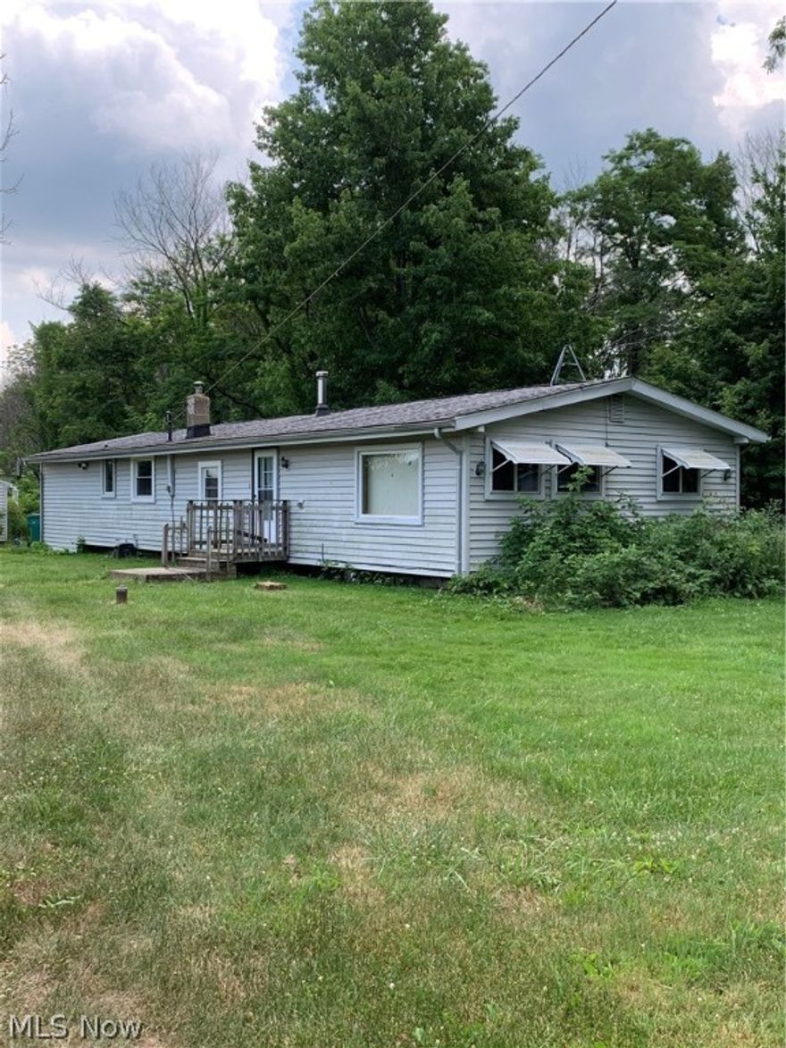 This awesome 6.7 acre property has a modular/manufactured home that needs a little TLC.