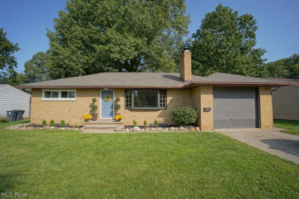 Spectacular brick Mid-Century Ranch in prime West Akron location. This amazing home has been been brought into the 21st Century with sophisticated and current updates. Great curb appeal boasts landscaping features that include river stone rocks and crisp perennial shrubbery. Gorgeous brick woodburning fireplace in living room. The entire interior has been repainted in 2020 in fashion neutral colors! Kitchen has been completely remodeled, including shaker styled white cabinetry and beautiful vinyl plank laminate flooring. Most of the 1st floor features natural hardwood flooring. 3rd bedroom can be den /family room and has views of covered patio and landscape. Windows replaced in 2020 along with a brand new complete "tear off" roof in 2020. Throughout the home you will notice cutting edge lighting that includes LED canned lighting. Seller replaced electrical Service box recently and there's plenty of space to add on. Seller replace much of the plumbing. The ceiling on patio overhang is
