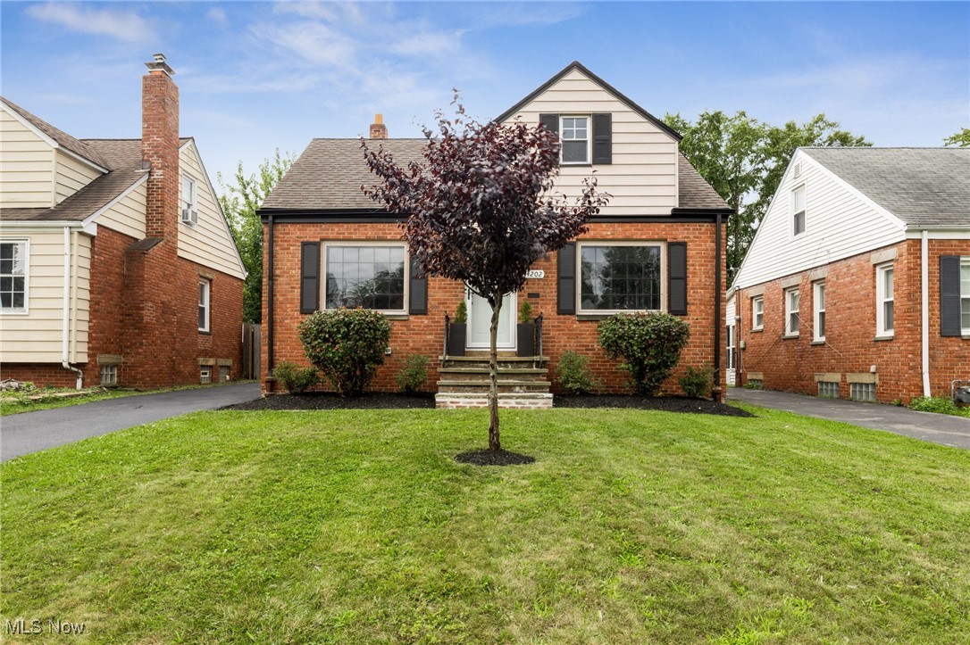 Charming and well-maintained, this classic brick bungalow offers cozy comfort and timeless appeal. Featuring 3 bedrooms, 1.5 bathrooms, and warm hardwood floors throughout much of the home, this property is freshly painted throughout with an updated full bathroom and stainless appliances. The inviting living room is filled with natural light and a fireplace, while the eat-in kitchen provides ample cabinet space. A spacious upstairs bedroom offers privacy and versatility—perfect for a home office or additional primary suite. Enjoy the seasons in the fenced backyard with cozy greenhouse or relax on the back patio. Located on a quiet street just minutes from parks, shopping, and dining, this is a perfect place to call home!