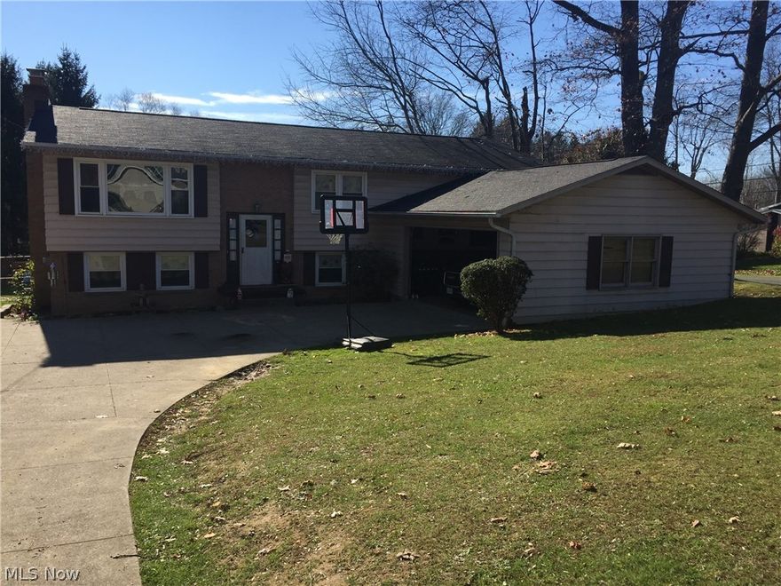 This charming 4 bedroom 2 bath house features 3 bedrooms on the main floor. First floor living room with wood burning fireplace. Kitchen features custom "Galehouse" cabinets. Formal dining room with glass slider to deck. Master suite has master bath and spacious closets. Lower level includes another bedroom, living area, and laundry. Updates throughout house to include windows, furnace, H20. Motivated seller. Room dimensions are approximate.