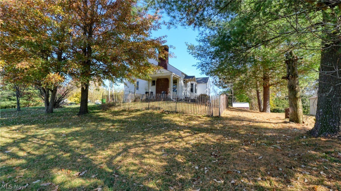 Darling 4 bedroom, 2 bath Cape Cod in the heart of New Concord. Hardwood floors, cozy fireplace. Beautiful open kitchen plan with stainless steel appliances. Newer electrical, public sewer & water. 1.24 acre treed lot. 8' x 10' shed. On a private lane.