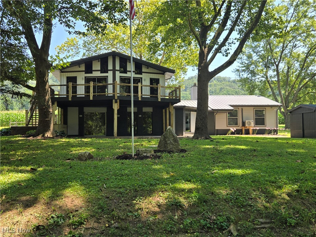 Luxury Riverfront Living with this gorgeous remodel by 2 AM Artistic Carpentry! This is riverfront living at its finest and the floor to ceiling windows over expansive views of the Muskingum River from almost every room! Complete Remodel! The stunning new kitchen opens up to the great room and features vaulted ceilings and an abundance of windows which flood this house with tons of natural light. The great room flows perfectly onto the 534 square foot deck and offers the perfect blend of indoor/outdoor living space, complete with a half bath, perfect for entertaining all your guests! On the lower level, you will find three bedrooms, including the massive master suite featuring a beautiful spa bath and a walk-in closet. Your luxurious master bath features an amazing walk-in shower with dual shower heads large soaking tub, and a private water closet. The lower level also has a family room with fireplace, a second full bath, two additional bedrooms, plus a bonus room that would make a great office, gaming room, or even a potential 4th bedroom. Walk out onto your beautiful patio or stroll down to the river where you fill find your own private dock! The beautiful property offers mature trees and plenty of room for the kids to run and play. This is a must see, everything is new! New Roof, Windows, Siding, Electrical, Plumbing, Mechanicals, Paint, Flooring, and Fixtures throughout! Call today to schedule a private showing!