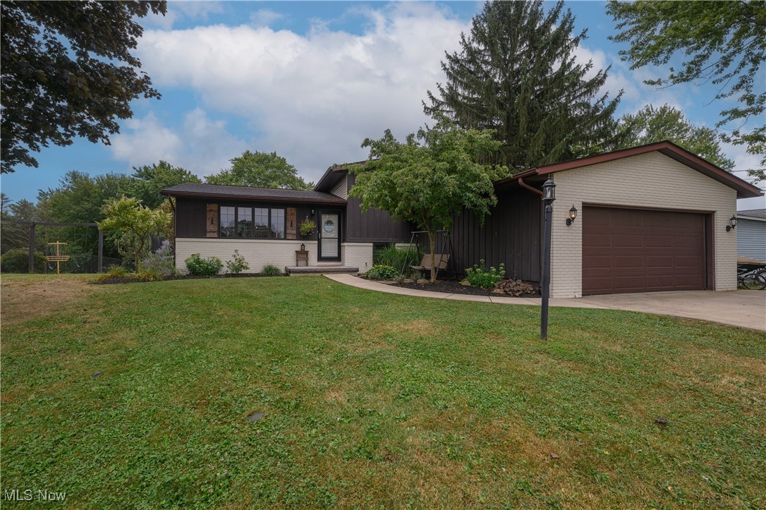 WOW! Check-out this lovely updated split level in beautiful Hartville! Sitting on just shy of 3/4's of an acre; this charming home comes with 3 beds, 2 full baths, and just under 1500sqft of wonderful living space! The Sellers have spared no expenses with the updates they've done; including the stunning updated main level open floorplan, fresh kitchen remodel, newer Provia Windows with lifetime transferrable warranty to the next owners, newer roof, septic, and more! Walk-in and be greeted by a lovely open floor plan with incredible finishes and attention to detail throughout! The upstairs level offers both guest bedrooms as well as the master bedroom just off of the spacious full bathroom! The lower level of the split comes equipped with an expansive den area, perfect for a bonus family or entertaining space with a second full bath being just steps away! The lower area also has walk-out access to the covered stamped concrete patio, which overlooks the amazing backyard and huge garden area! This charming home truly has so much to offer! Call me today for your private showing to see it for yourself!