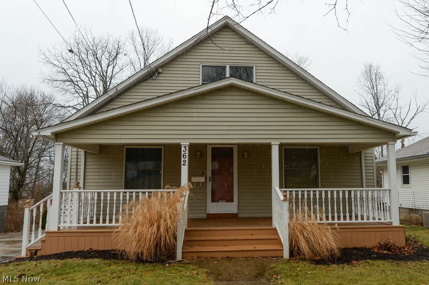 More than meets the eye! This wonderfully updated Ellet Cape has so much to offer. The super inviting huge front porch is just right to relax and wave to your neighbors. Living room, formal dining room and large eat-in kitchen. Kitchen has new vinyl flooring, solid oak cabinets, range, hood, refrigerator and dishwasher. There are 2 bedrooms and a full bathroom on the main floor too! On the second floor there is a large open loft/landing with lots of storage and room for a desk or reading area. There's also another full bathroom and 2 more bedrooms! Head down to the lower level with walk out for even more space. There is a large additional bedroom, tons of open space and glass block windows. There is a beautiful back deck overlooking the back yard, perfect for family time or entertaining guests. The extra wide driveway leads to the 2.5 car garage and provides tons of parking. Furnace 2002, hot water heater 2005, updated electric. A super solid home at a great price! Call fo