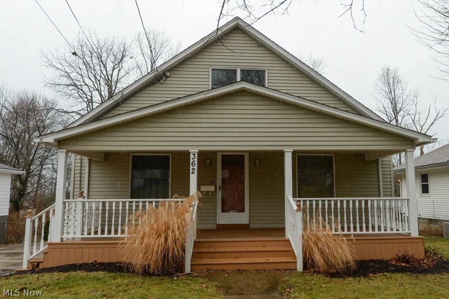 More than meets the eye!  This wonderfully updated Ellet Cape has so much to offer.  The super inviting huge front porch is just right to relax and wave to your neighbors.  Living room, formal dining room and large eat-in kitchen.  Kitchen has new vinyl flooring, solid oak cabinets, range, hood, refrigerator and dishwasher.  There are 2 bedrooms and a full bathroom on the main floor too!  On the second floor there is a large open loft/landing with lots of storage and room for a desk or reading area.  There's also another full bathroom and 2 more bedrooms!  Head down to the lower level with walk out for even more space.  There is a large additional bedroom, tons of open space and glass block windows. There is a beautiful back deck overlooking the back yard, perfect for family time or entertaining guests.  The extra wide driveway leads to the 2.5 car garage and provides tons of parking.  Furnace 2002, hot water heater 2005, updated electric.  A super solid home at a great price!  Call fo