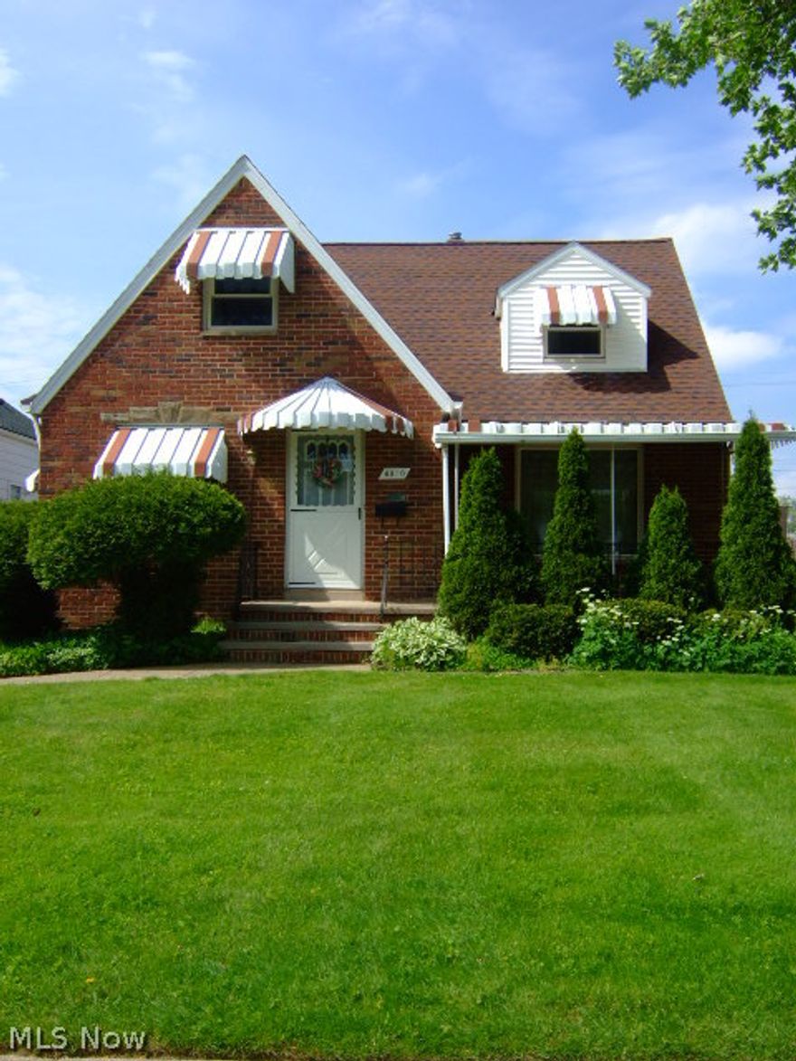 Move in & enjoy this charming solid all brick cape! Greet your guests in the charming entry w glass panel door.  The spacious living rm features neutral décor & decorative FP. Newer carpet throughout w hardwd floors underneath. The eat- in kitchen features updtd/refaced cabinets, a newer refrigerator & spacious dinette.  There are 2 bedrms w ample closet space on the first floor.  The upper level features a huge master suite w private bath, gleaming hardwd floors, sitting nook & loads of storage space! The cozy bonus rm w beaut. hardwd floors would be a great home office or play rm . The recreation room on the LL is a great space for entertaining! It features glass block wndws, beaut. paneled walls and fun game themed flooring. The utility rm features a cheery laundry area & a separate work area.  Updates: garage roof (5/14), furnace and A/C (9/09), H2O tank (5/09), refrigerator (9/09), gutter toppers (8/06), kitchen cabs refaced (10/03) and more! Fab covered front porch! 2 car garage