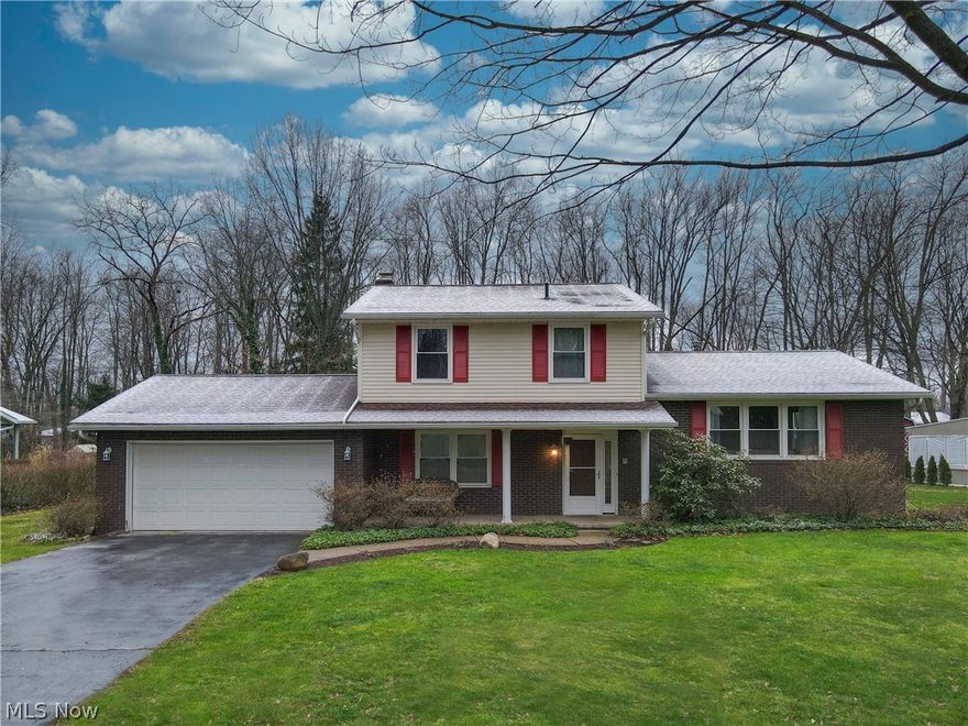 Welcome to 13611 Greenland Avenue NW in Uniontown Ohio! This Spacious Split Level Has So Much to Offer! With 3 Bedrooms and 2.5 Bathrooms Located on a Quiet Street In Lake Local School District! The Custom Kitchen Offers Granite Countertops, Backsplash, Stainless Sink, and 1 Year Old Appliances (Refrigerator, Dishwasher, and Range)! A First Floor Office Or Mudroom with a Custom Built in Desk and Custom Cabinets Welcomes You From The Garage Entrance (2022). First Floor LVP Flooring (2022), First Floor Half Bath Flooring, Drywall, Custom Vanity with Hardwood Top (2022). On Suite Bathroom Custom Tile Floor and Vanity (2020). The Back Patio Opens up to a Large Flat Lot With A Newer Large 12x16 Shed (2022). And For You Garden and Fruit Lovers This Backyard Comes with 9 Custom Built Raised Beds and Your Very Own Apple Orchard!