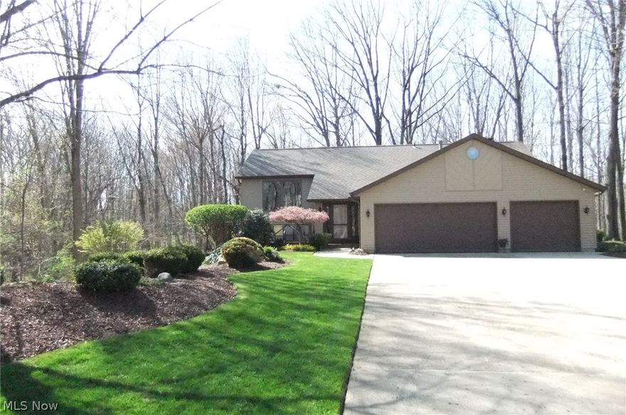 One-owner custom built home with over 3,300 Sq. Ft. of living area. Home is situated on 1 acre of breathtaking scenic wooded land with a meandering brook and walking paths yet less than 10 minutes to Rte 2 in the heart of Mentor. Home has many updates. Kitchen with quartz countertops plus new stove and sink (9/15) and newer kitchen floor. Morning room area with new storm door leading to 1 of 3 decks overlooking private yard. There is also a walk-in pantry. Great room has rough sawn cedar with soaring ceilings with recessed lighting and a raised hearth fireplace with new gas logs (1/15). Oversize den/office with custom built cabinetry and bay window with built-in window seat could be master bedroom if desired. Formal dining room has slider that leads to screened in Florida room overlooking 2 decks and yard. Formal living room has built-in wet bar for entertaining. Extra wide staircase leads to lower level with 3 bedrooms plus a family/media room 18x15 with its own separate entrance that