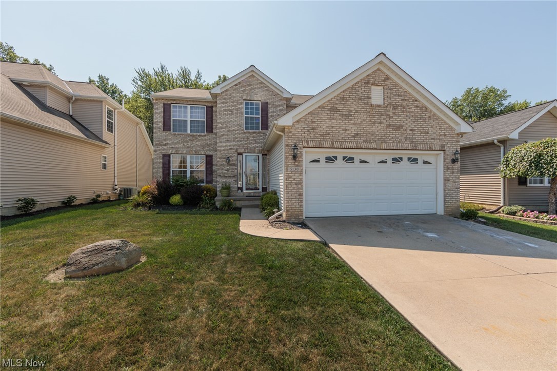 There is plenty of curb appeal with this brick front colonial in the desirable Avalon Estates. Newer laminate flooring greets you as you enter the home. The front of the home features french doors leading to a home office space. Across from the office is formal dining/entertainment room. First floor includes a powder room and laundry. A spacious, open kitchen floor plan features granite countertops with plenty of cupboard space. Newer stainless steel appliances included. Breakfast nook overlooks living room with gas log fireplace. Transition from the kitchen to a bonus sun room, which offers an abundance of natural sunlight through the generous windows and sky lights. You will love entertaining on the large deck located off the rear of the home. Deck overlooks a serine wooded setting. The second floor includes four bedrooms and two full baths. The primary en-suite features a walk-in closet, double bowl sink vanity, jetted tub & shower. Full unfinished basement has plumbing roughed in f