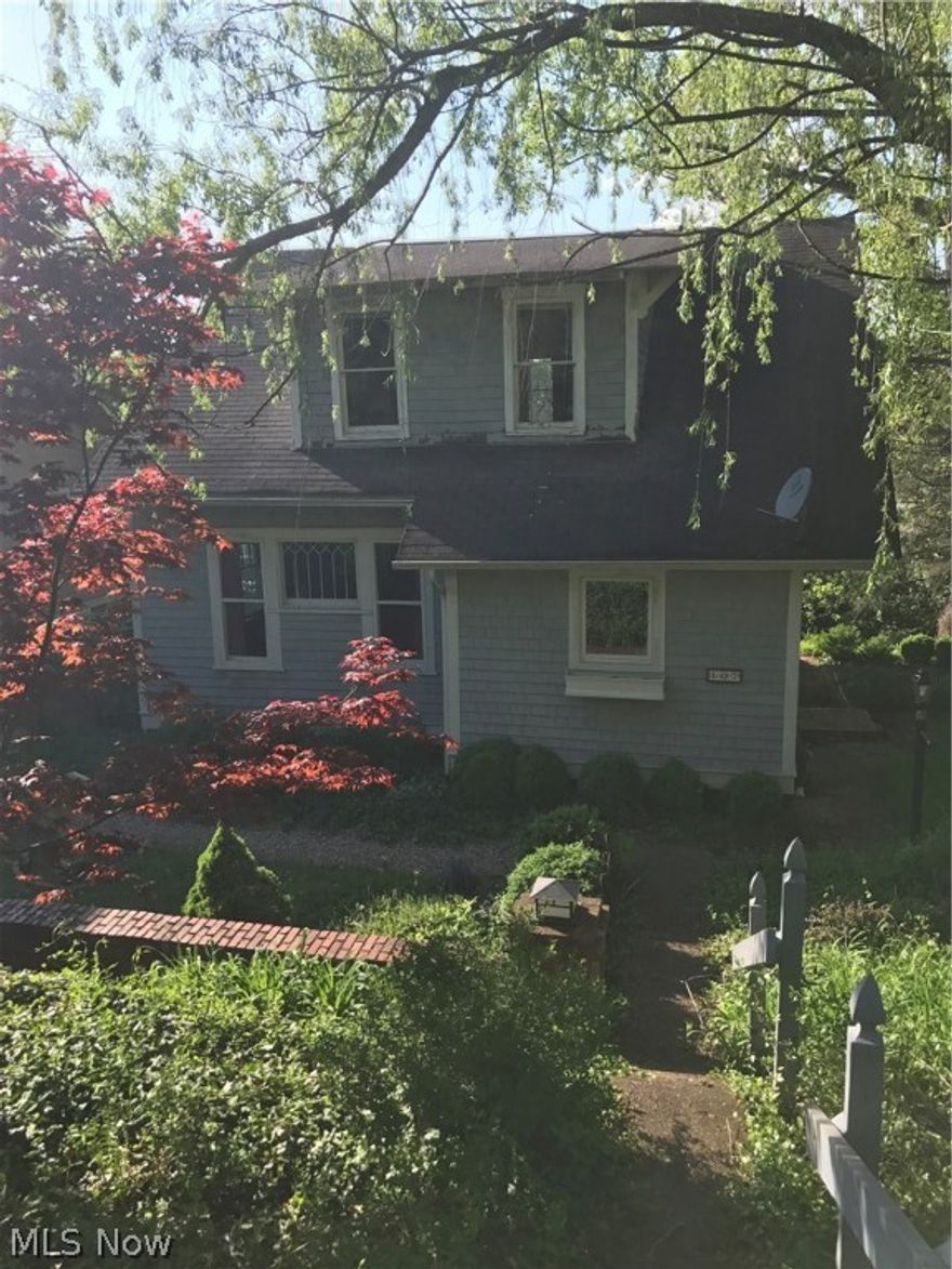 French country feel with lots of charm. Hardwood floors and original woodwork thru out. Custom built in and pocket door off living room in pristine condition. Some updates ,newer cabinets and light fixtures, furnace appears to be new. Front porch in need of some minor repairs. Basement appears to have been in the process of work being done to it. Home appears to have been well cared for and maintained